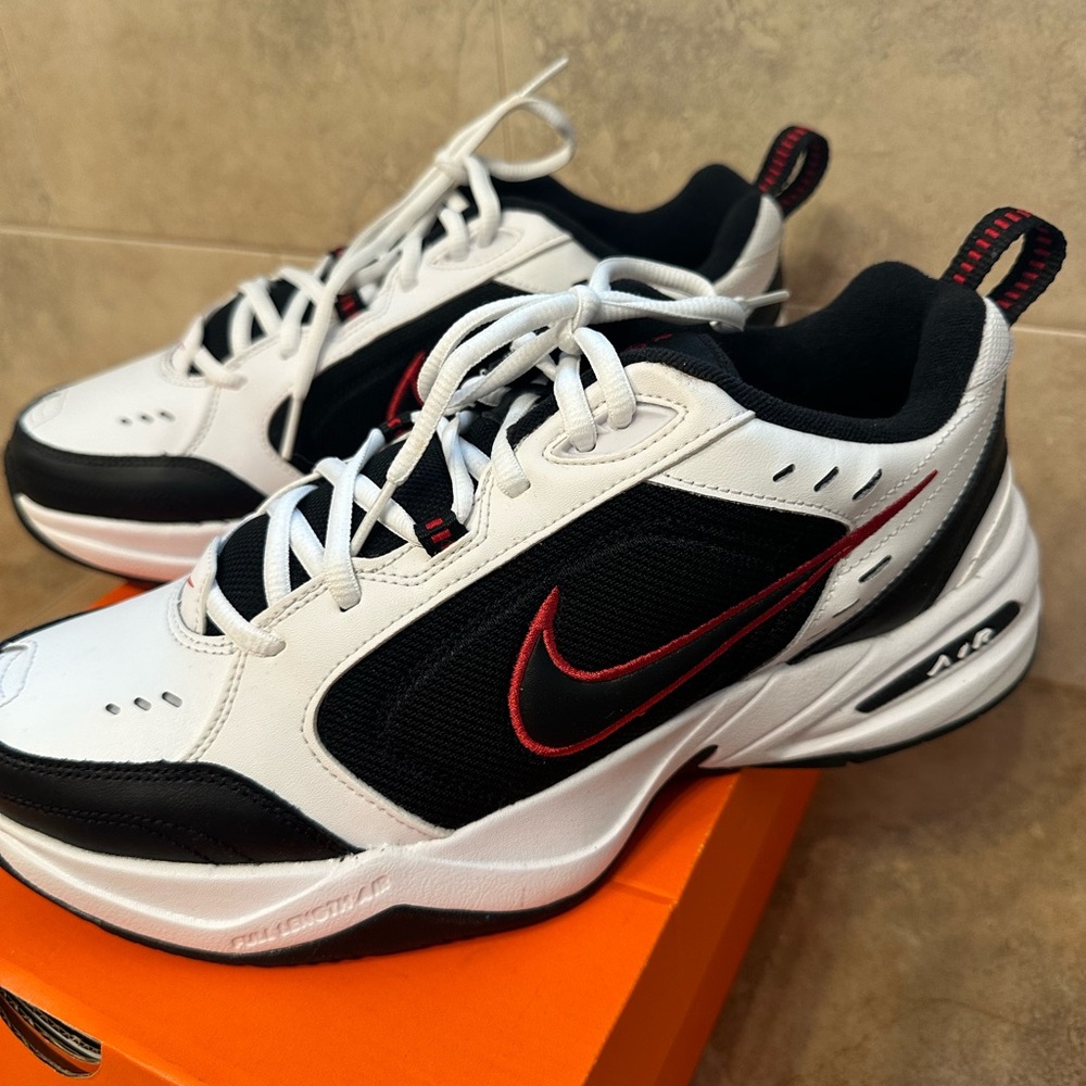 Like new Mens Nike Air Monarch IV sneakers.  Size 10.